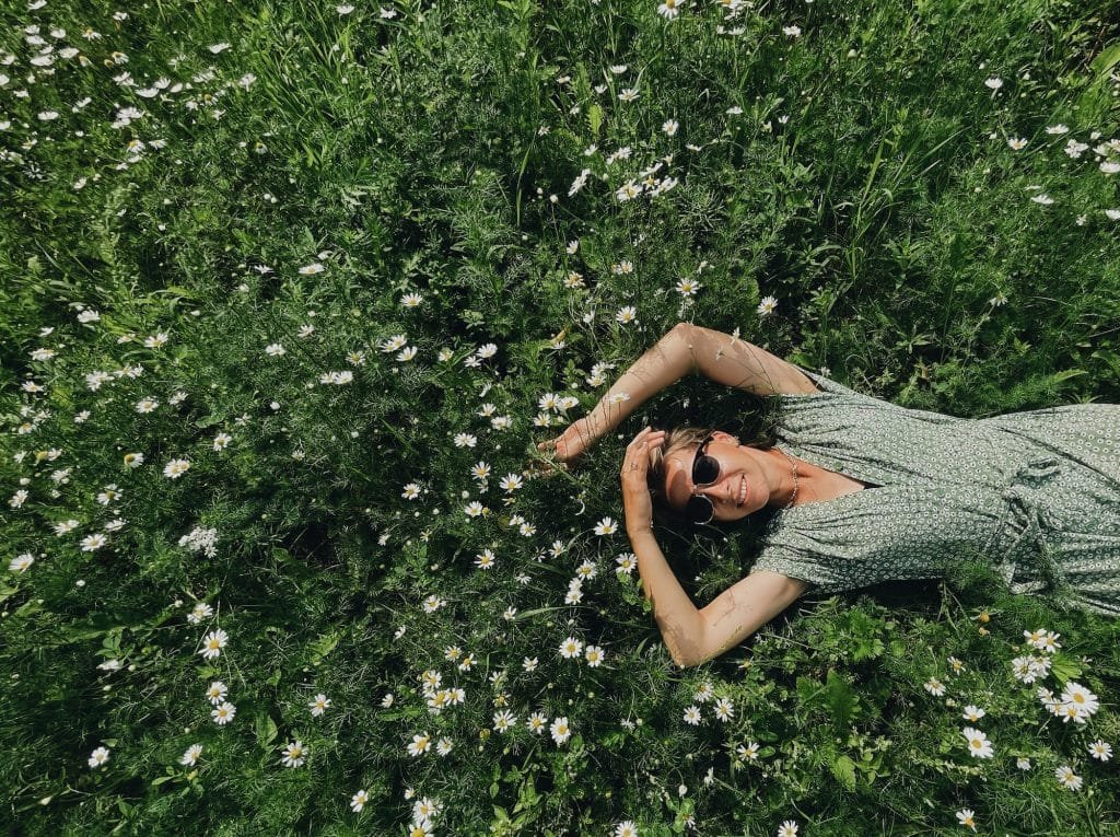 Young woman in green grass