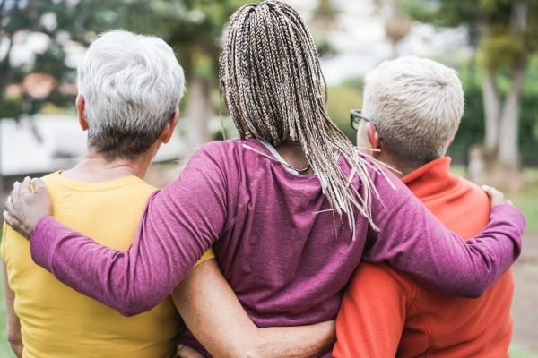 Multiracial senior women having fun together after yoga session outdoor